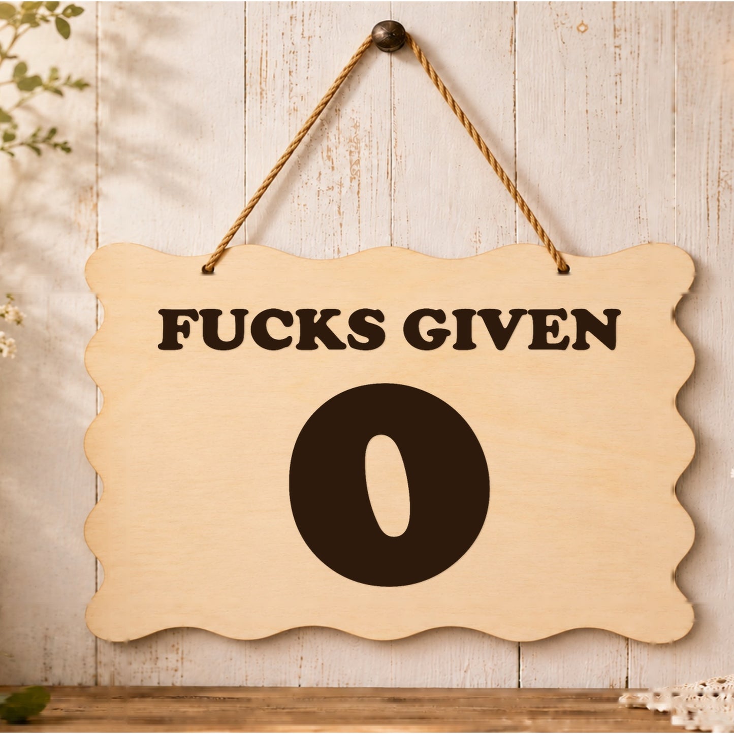 0 F**ks Given funny wooden plaque displayed in a styled setting