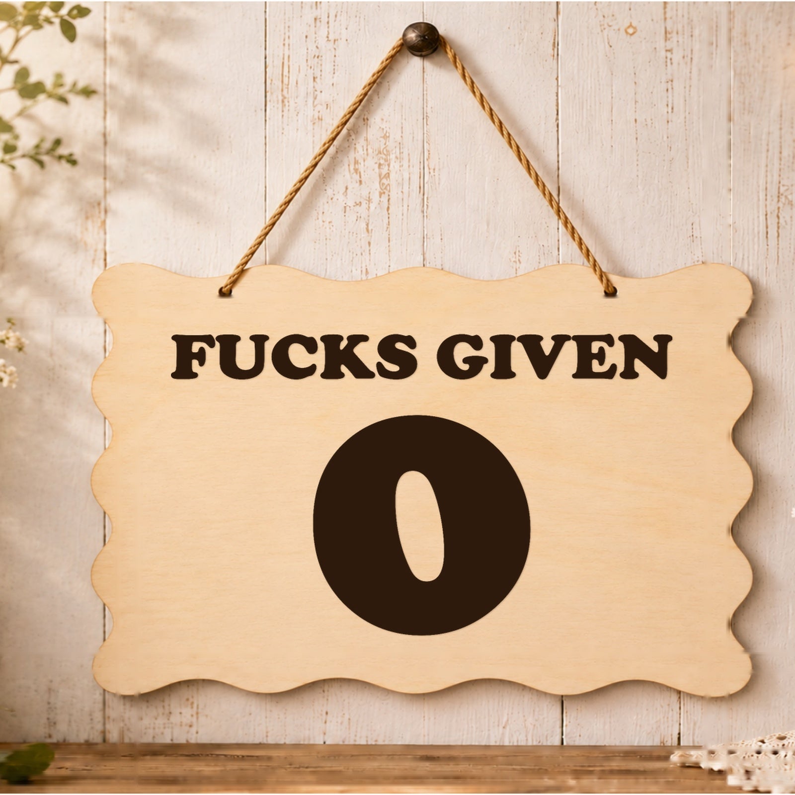 0 F**ks Given funny wooden plaque displayed in a styled setting