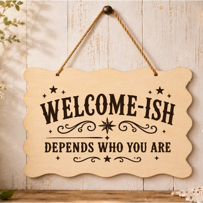 Welcome-ish Depends Who You Are plaque displayed by a front door