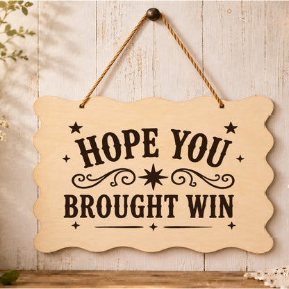 Hope You Brought Wine wooden plaque displayed in a home setting