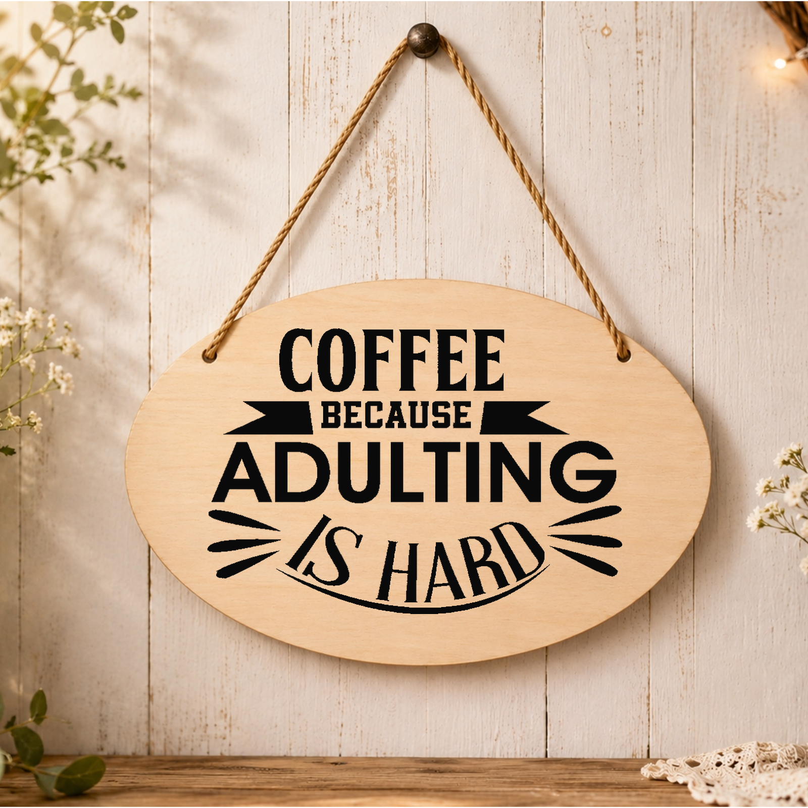 Coffee Because Adulting Is Hard plaque displayed by a coffee station