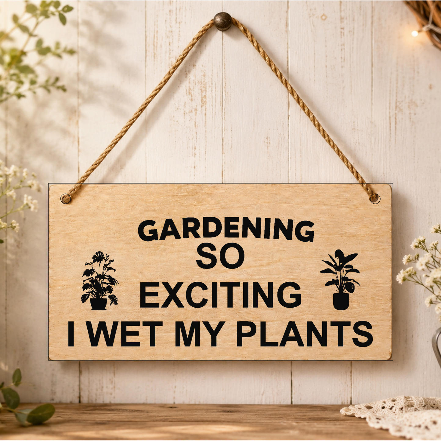 Gardening: I Wet My Plants wooden plaque displayed in a garden setting