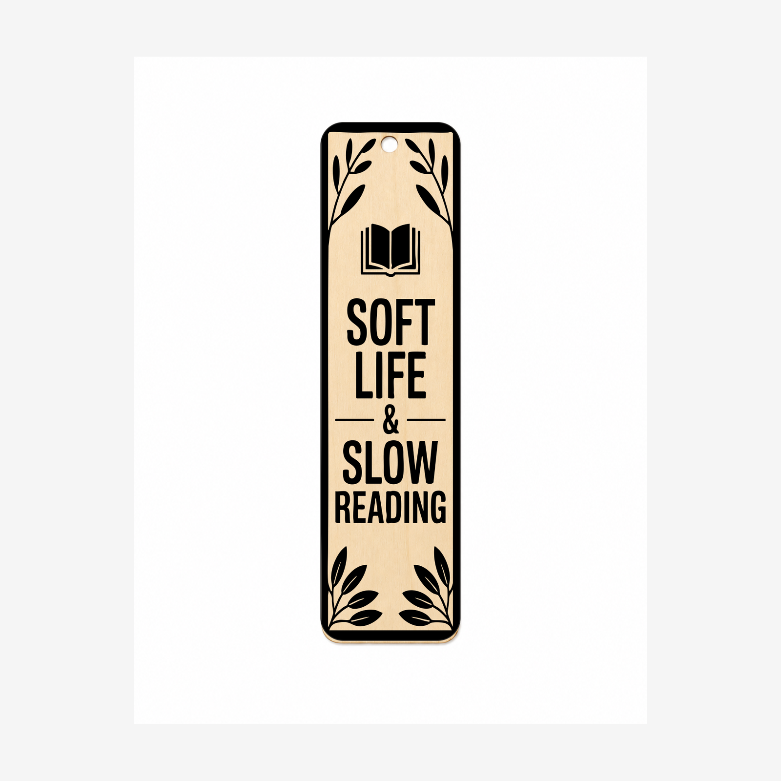 Soft Life and Slow Reading laser engraved wooden bookmark on a white background