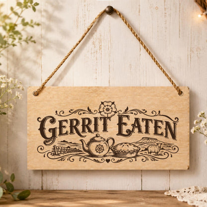 Gerrit Eaten wooden plaque displayed in a kitchen setting