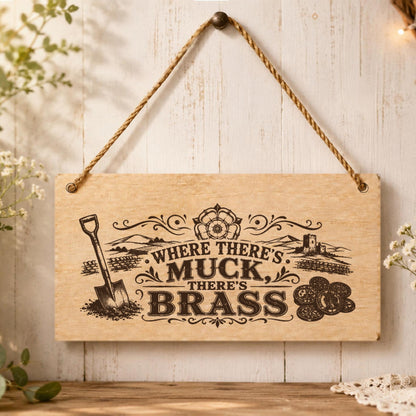 Where There’s Muck There’s Brass plaque displayed in a home setting