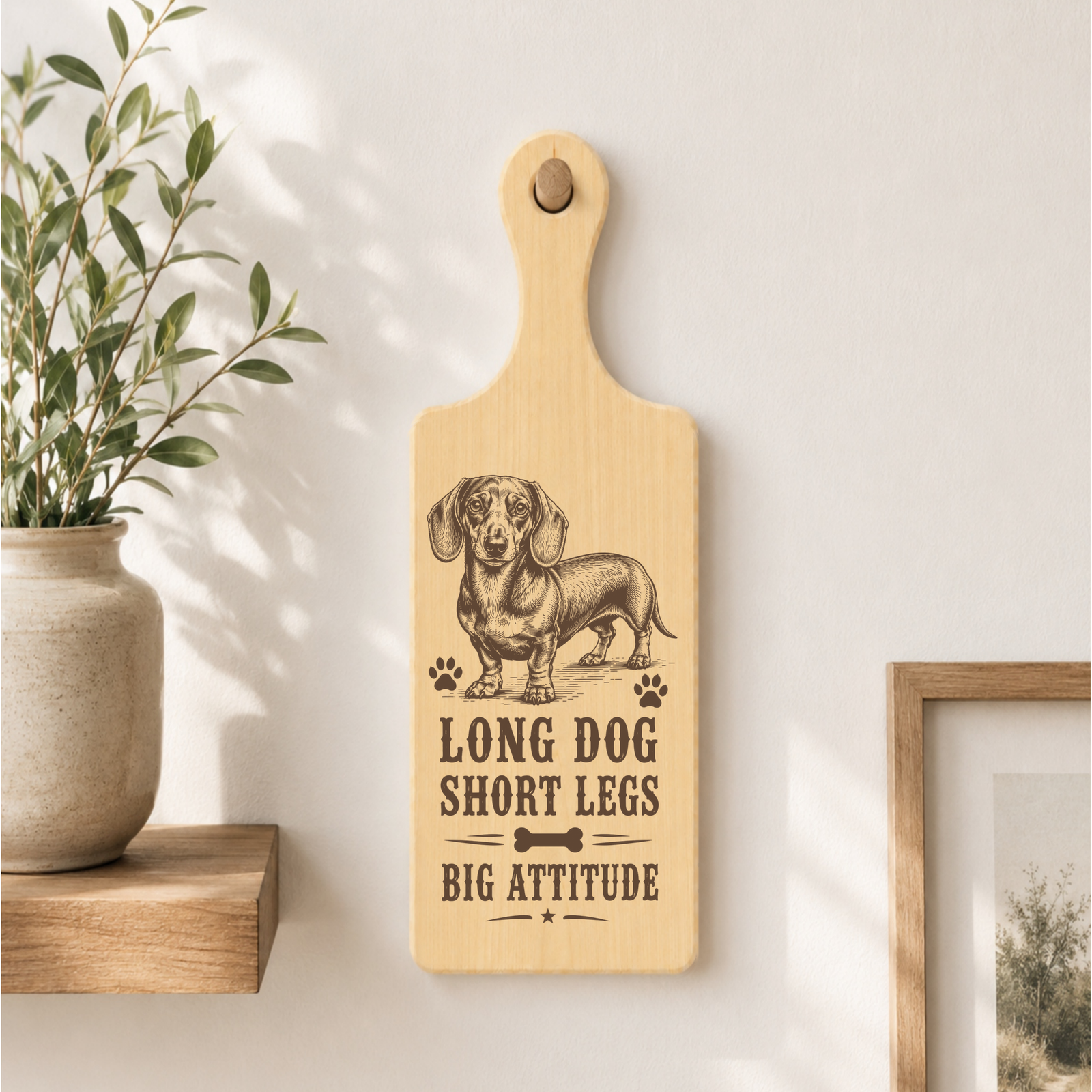 Long Dog Short Legs Big Attitude plaque displayed in a dog-friendly home setting