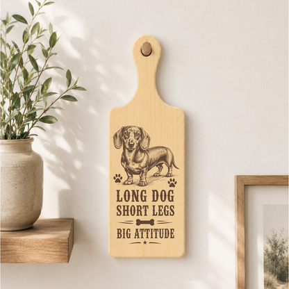 Long Dog Short Legs Big Attitude plaque displayed in a dog-friendly home setting