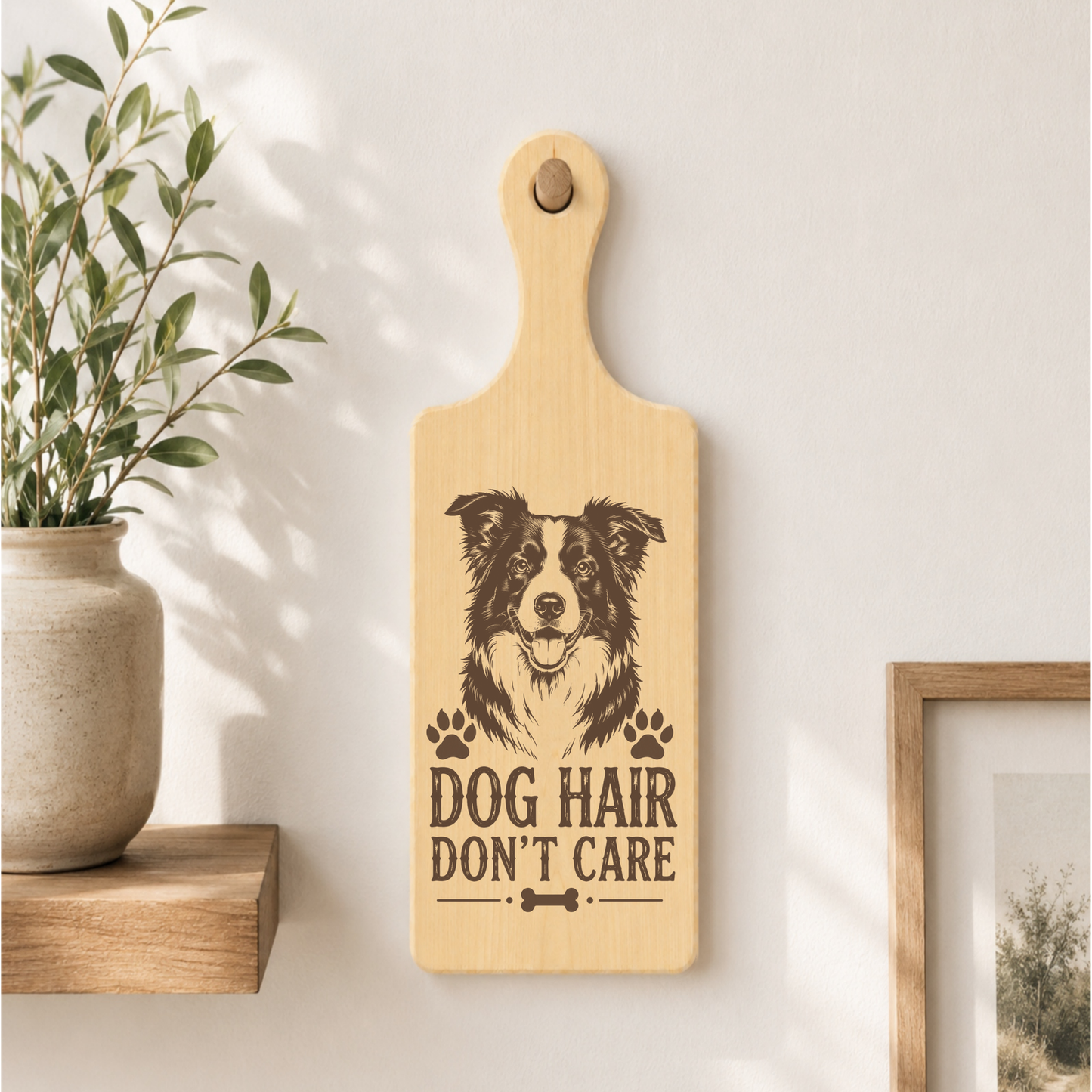 Dog Hair Don't Care wooden plaque displayed in a home setting