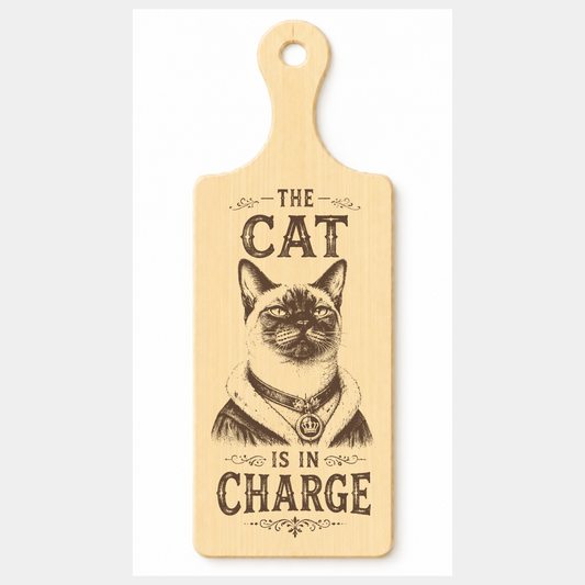 The Cat Is in Charge wooden paddle plaque on a white background