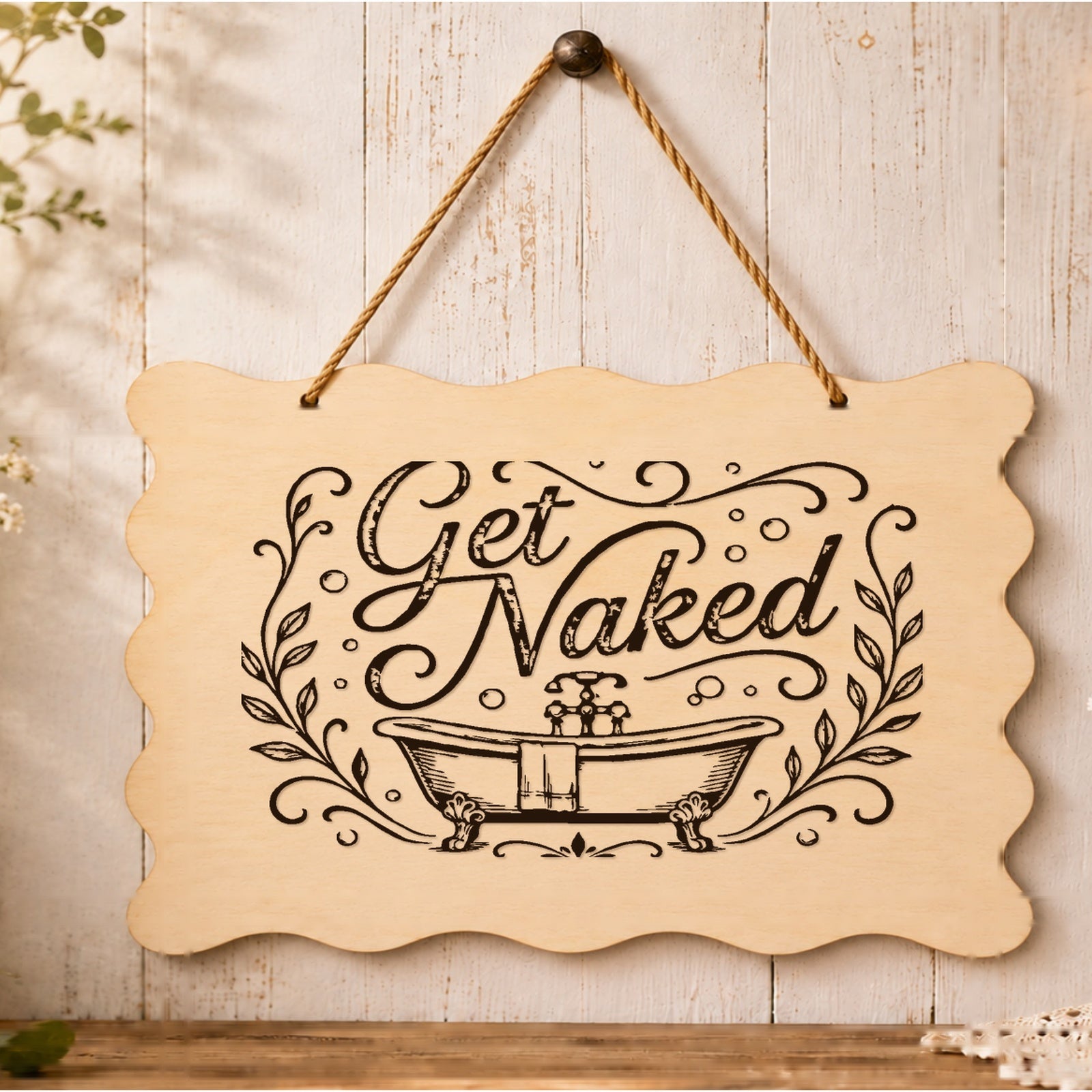 Get Naked scalloped wooden plaque displayed in a bathroom setting