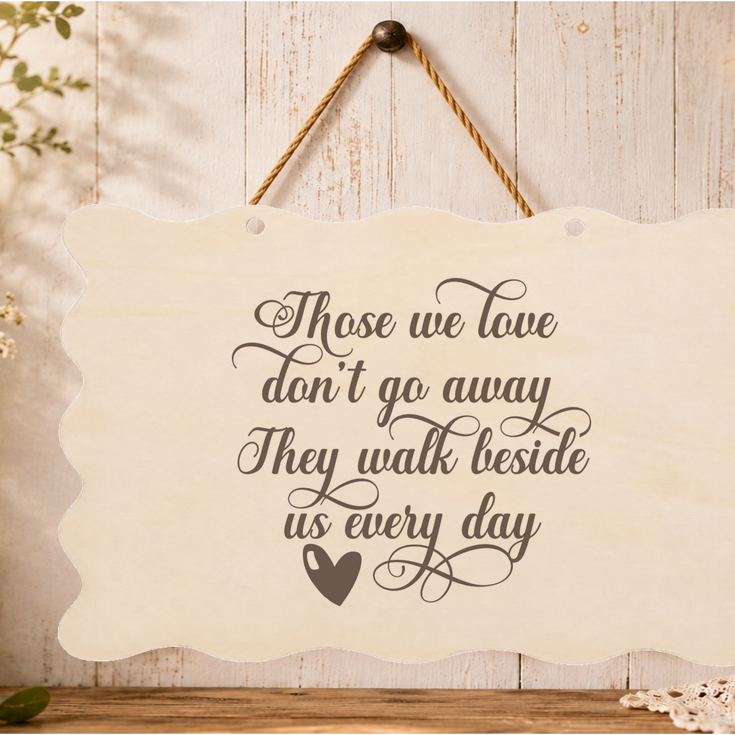 Those we love dont go away memorial plaque hanging on a wall