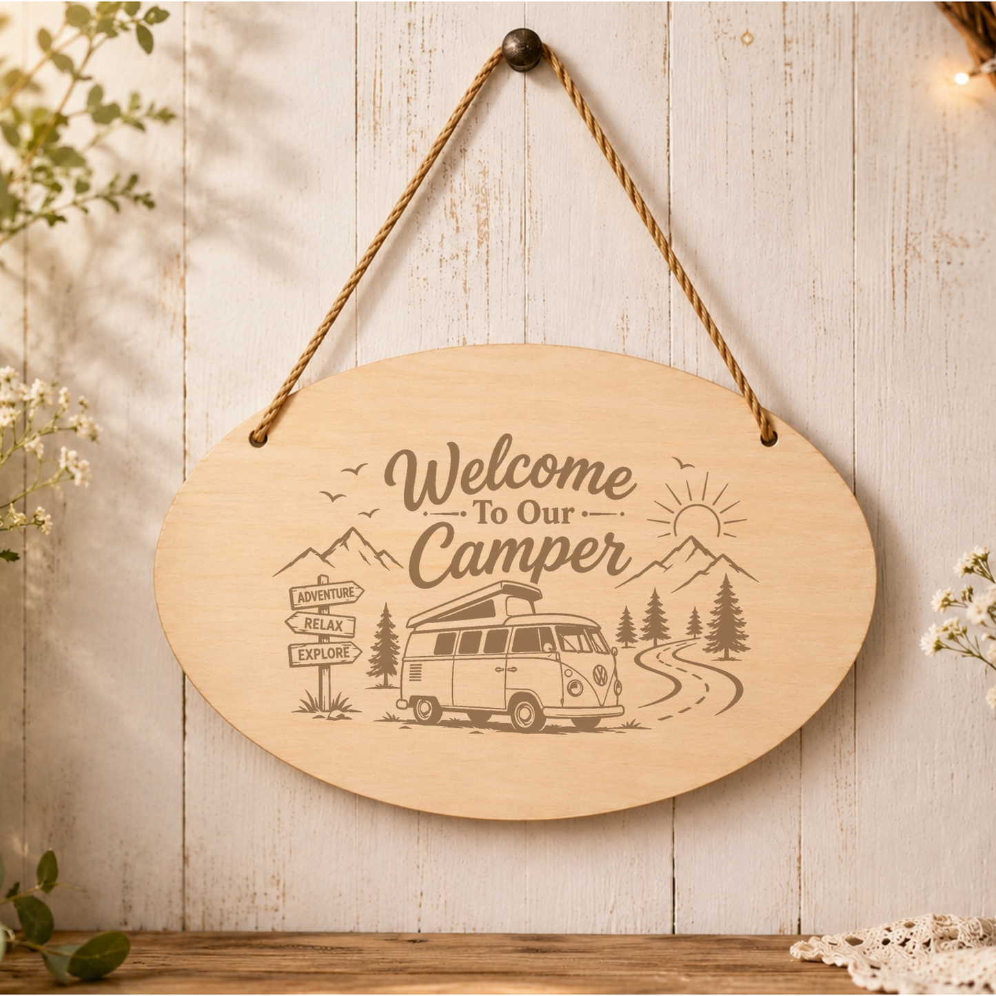Welcome to Our Camper oval plaque displayed in a camper setting