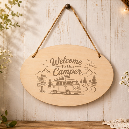 Welcome to Our Camper oval plaque displayed in a camper setting