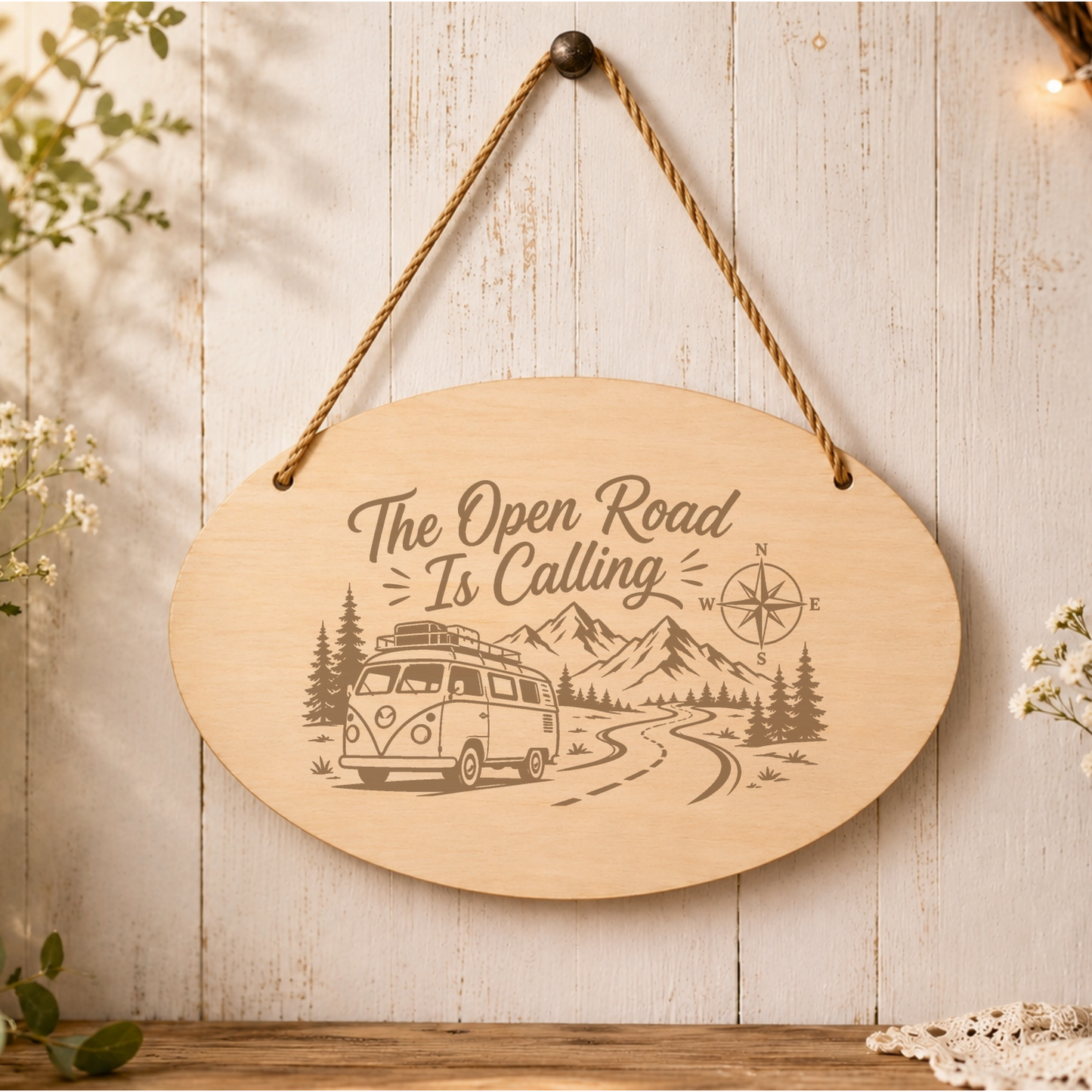 The Open Road Is Calling oval plaque displayed in a caravan setting