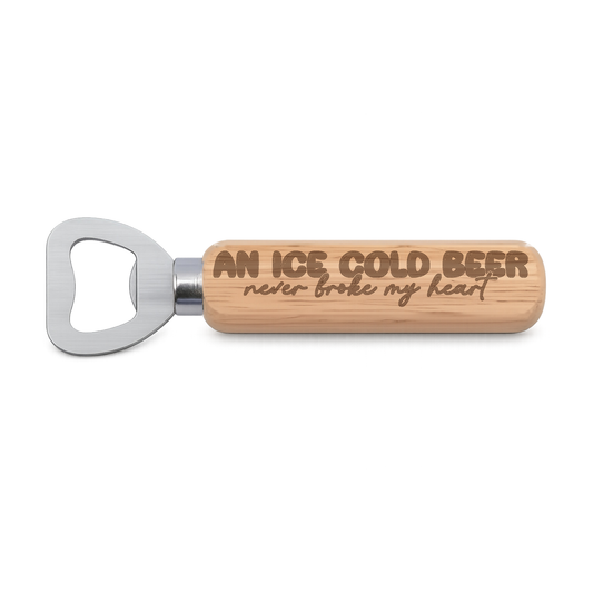 An Ice Cold Beer Never Broke My Heart engraved wooden bottle opener on a white background