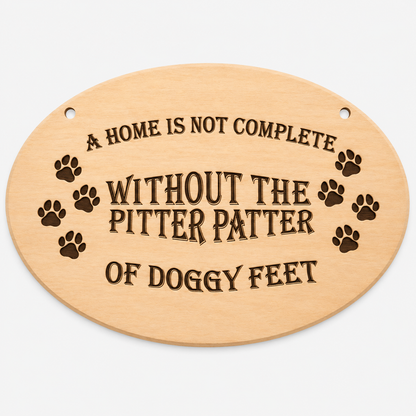 A Home Is Not Complete Without Doggy Feet oval wooden plaque on a white background