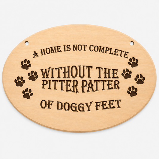 A Home Is Not Complete Without Doggy Feet oval wooden plaque on a white background