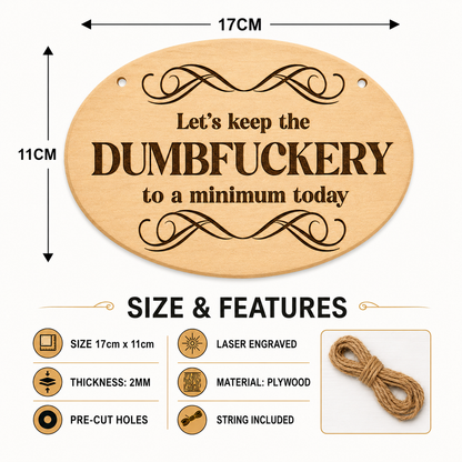 Keep the Dumbfuckery to a Minimum plaque displayed in a workplace setting