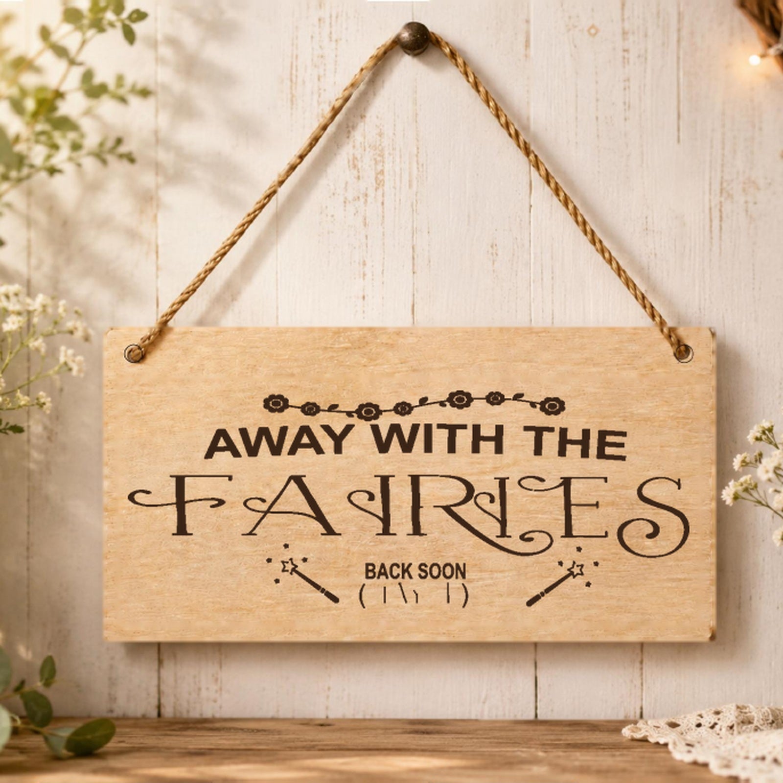 Away With The Fairies wooden plaque displayed in a whimsical room setting