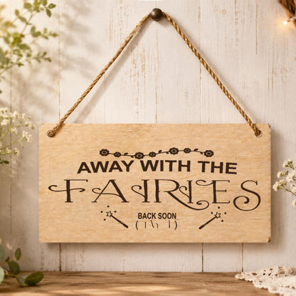 Away With The Fairies wooden plaque displayed in a whimsical room setting