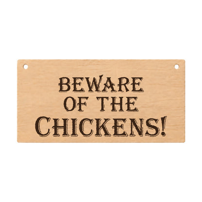 Beware of the Chickens funny laser engraved wooden plaque on a white background