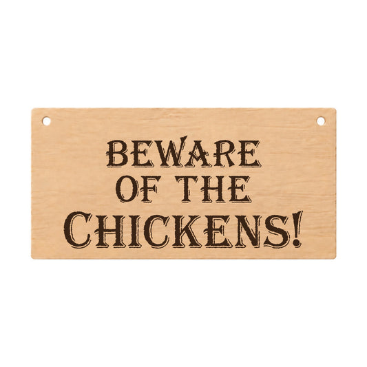 Beware of the Chickens funny laser engraved wooden plaque on a white background