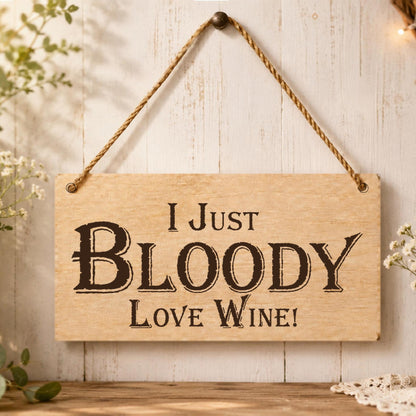 I Just Bloody Love Wine plaque displayed in a kitchen or home bar setting