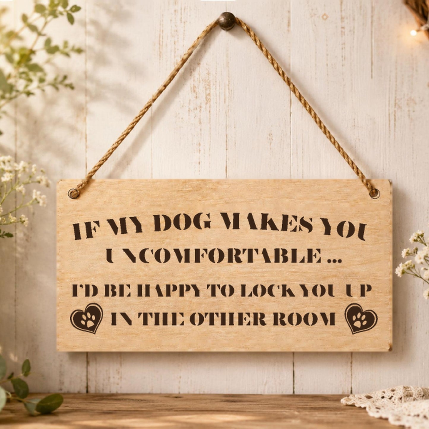 If My Dog Makes You Uncomfortable plaque displayed in a home setting