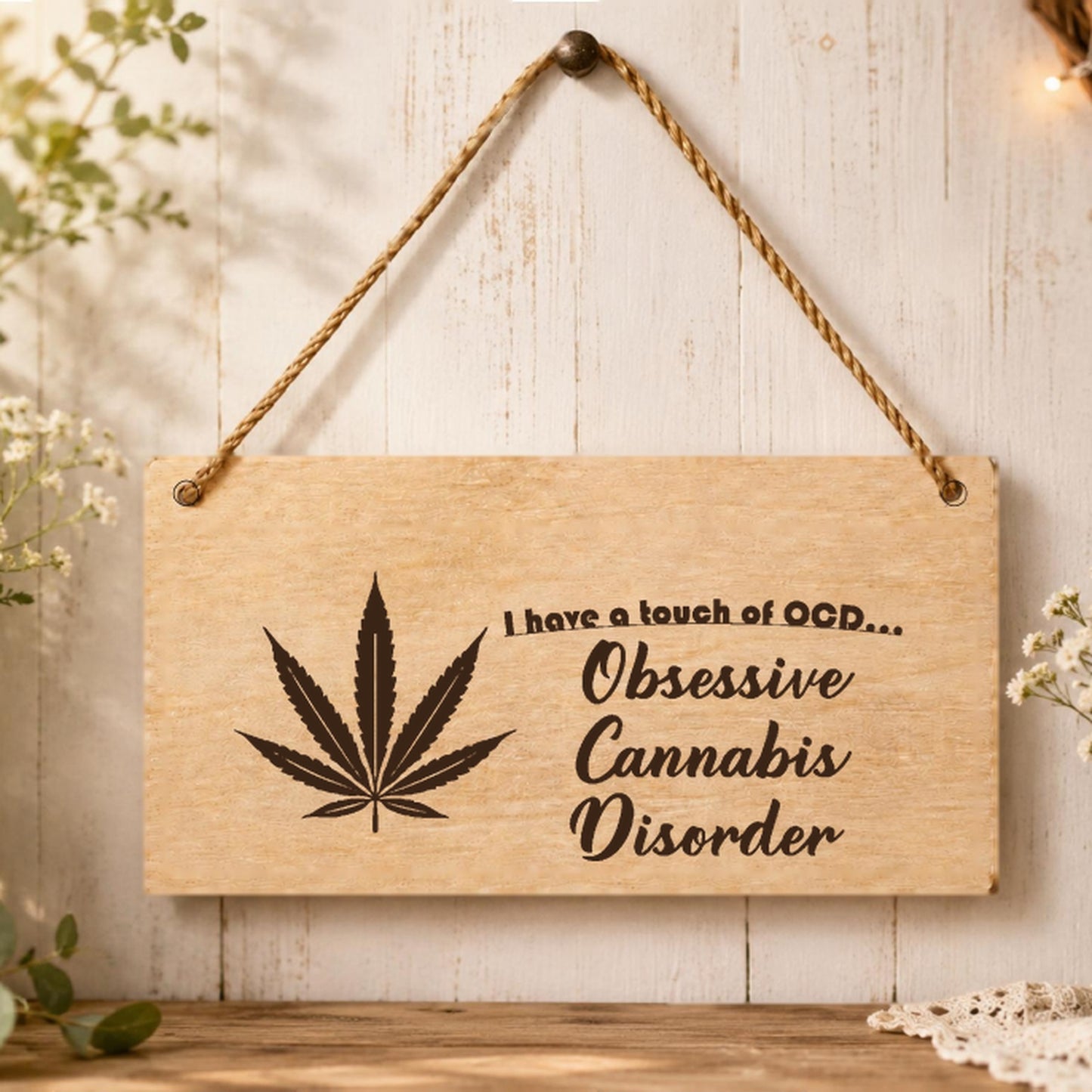 Obsessive Cannabis Disorder novelty plaque displayed in a room setting