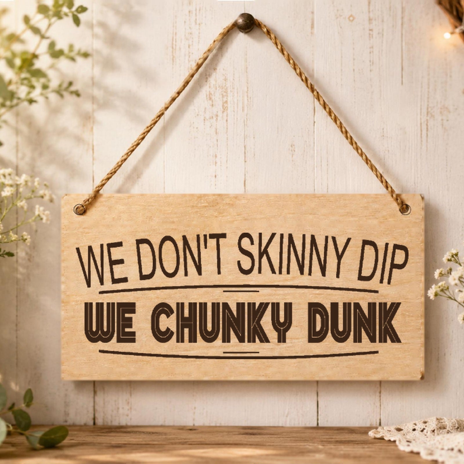 We Don’t Skinny Dip We Chunky Dunk plaque displayed near a hot tub