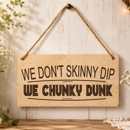 We Don’t Skinny Dip We Chunky Dunk plaque displayed near a hot tub