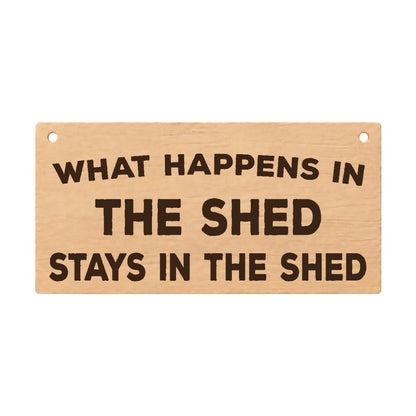 What Happens in the Shed Stays in the Shed wooden plaque on a white background