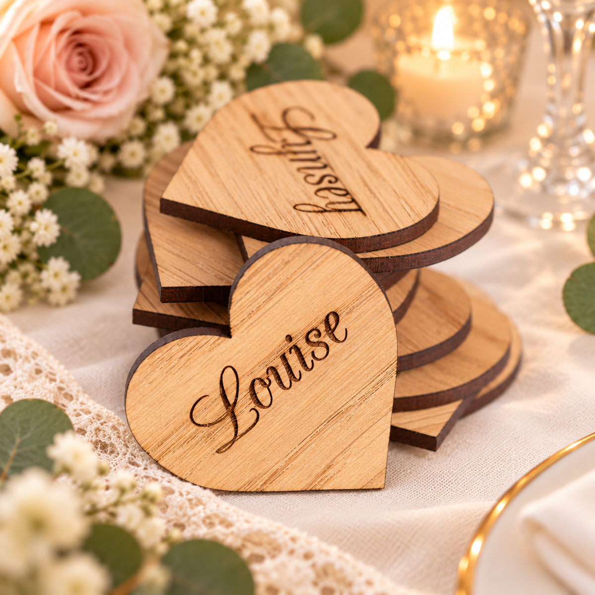 Laser engraved wooden heart wedding place names on a romantic wedding table